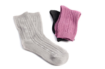 three pairs of socks of different colors, isolated on white