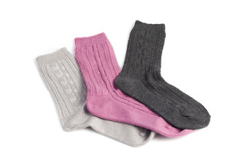 three different socks, pink, gray and black, isolated on white
