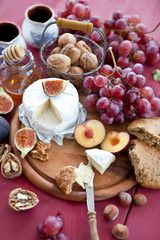 Cheese, bread and autumn fruit