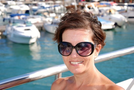 woman sitting on the deck of a cruise ship