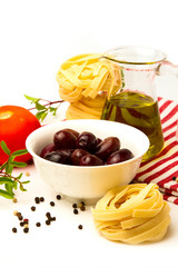 Italian pasta with olives, olive oil and tomato