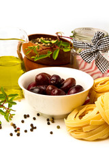 Italian pasta with olives, olive oil and tomato