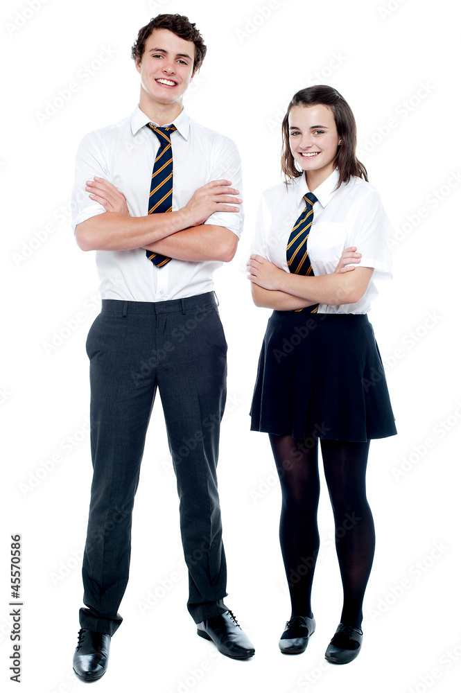 Wall mural Students in uniform posing with arms crossed