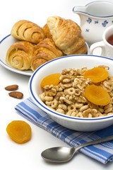 Breakfast cereal with croissant and dry apricot