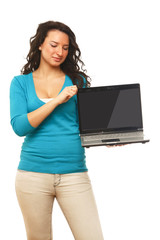 A woman showing an empty screen of a laptop