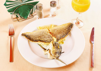 Roasted fillet of Dorada fish on a plate