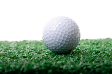 Golf ball ower green grass