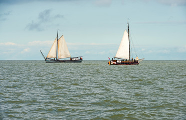 Fototapeta premium Sailing boat on a lake at fall