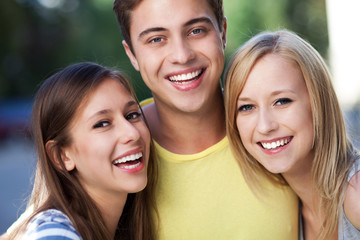 Young man with two female friends