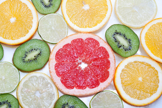 Mix of colorful citrus fruit on white