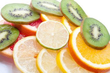 Mix of colorful citrus fruit on white