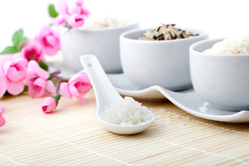 uncooked rice with porcelain bowls