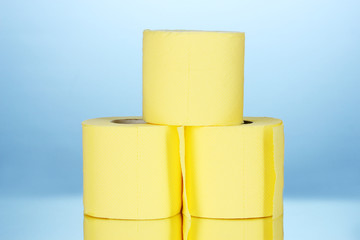 rolls of toilet paper on blue background