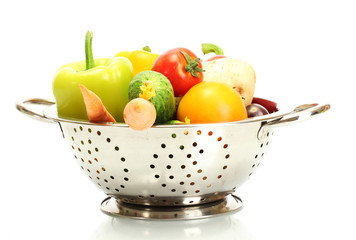 fresh vegetables in silver colander isolated on white