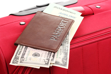 Passport and ticket on suitecase close-up
