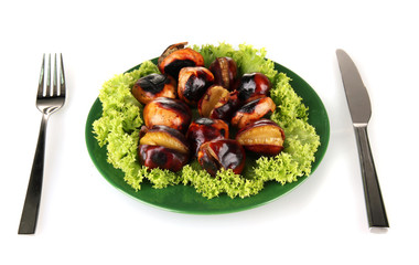 roasted chestnuts with lettuce in the green plate with fork and