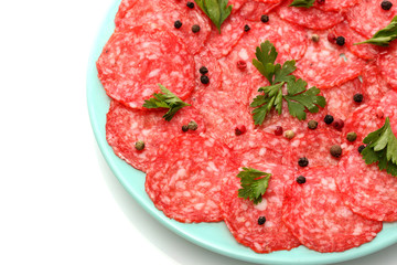 tasty sausage with spices on plate, isolated on white