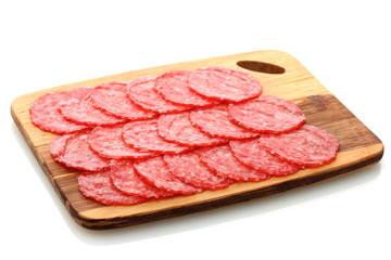 tasty sausage on wooden cutting board, isolated on white