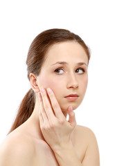 Fototapeta premium A beautiful woman touching her face