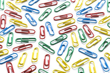 colorful paperclips on white