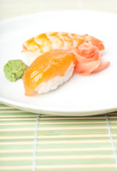 Nigiri sushi on the plate with wasabi sauce
