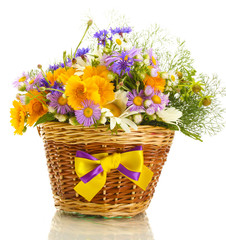 beautiful bouquet of bright  wildflowers in basket, isolated