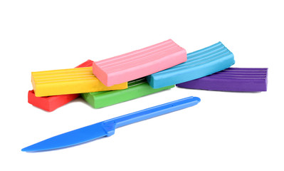 Children bright plasticine with stack isolated on white