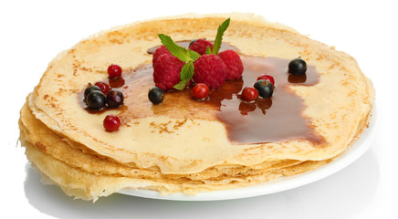 Delicious pancakes with berries and chocolate