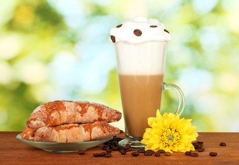 glass of fresh coffee cocktail and saucer with bagels