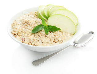 tasty oatmeal with apple, isolated on white