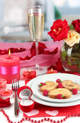 Table setting in honor of Valentine's Day on room background