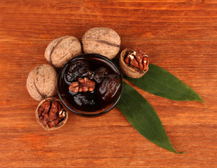 jam of walnutsjam walnuts in a bowl  on wooden table