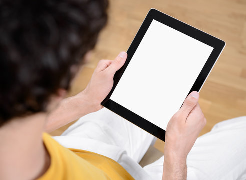 Holding digital tablet with blank screen