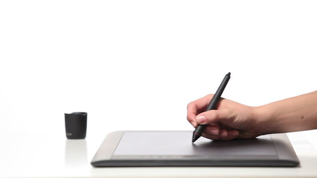 Person drawing on a computer tablet