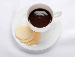 Cup of coffee and biscuits isolates