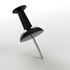 close up of a black pushpin on white background