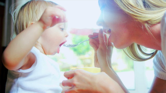 Little Girl Learning Feed Herself
