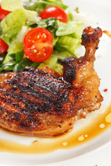 Roasted chicken leg with salad