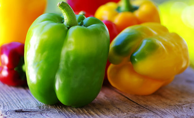 yellow, red, green peppers on table
