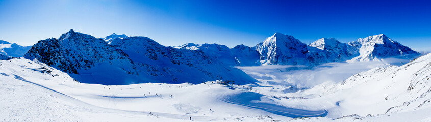 Winter mountains, panorama - ski slopes in the Italian Alps