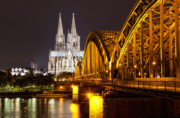 Cologne Gothic Cathedral at night as seen from the Rehin