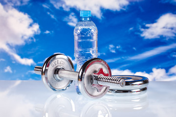 fitness equipment and water on bluesky background