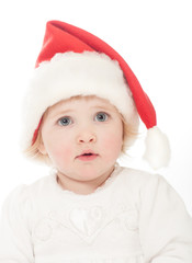 Cute baby girl in Santa's hat