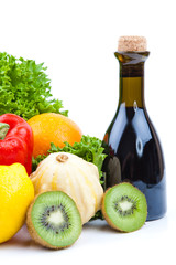 fruits and vinegar bottle isolated on white
