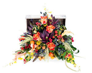 A colorful floral arrangement of roses, lilies, freesia and iris