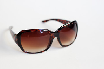 modern stylish sunglasses against white background