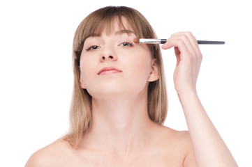 Fototapeta premium Beautiful woman with make up brush