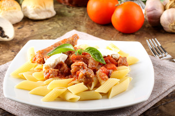 Pasta with tomato, sausage and ricotta