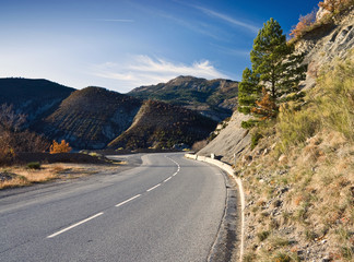 Naklejka premium Alpine winding road in French Alps