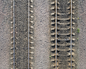 Fototapeta premium Background texture of railway tracks on gravel